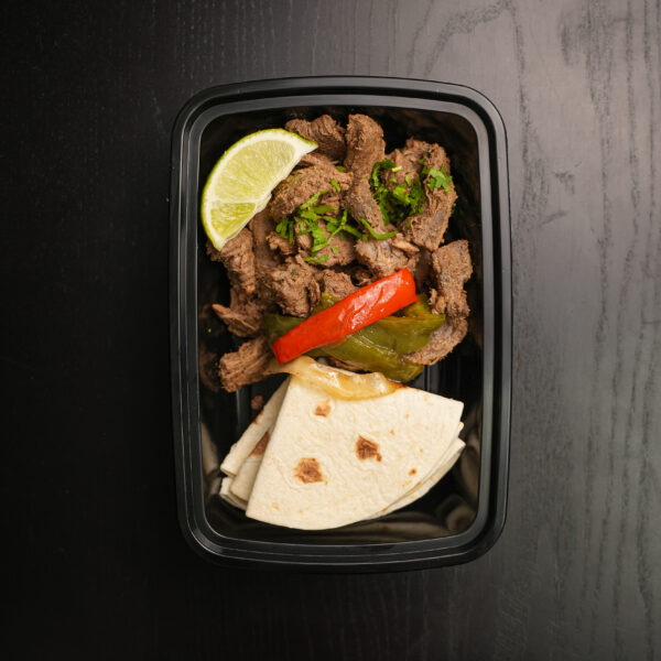 Steak Fajitas on Dark Table